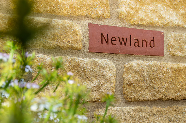 Every home has a 'Newland' brick as a seal of approval